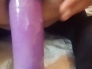 Thick femboy rides huge purple dildo up her ass